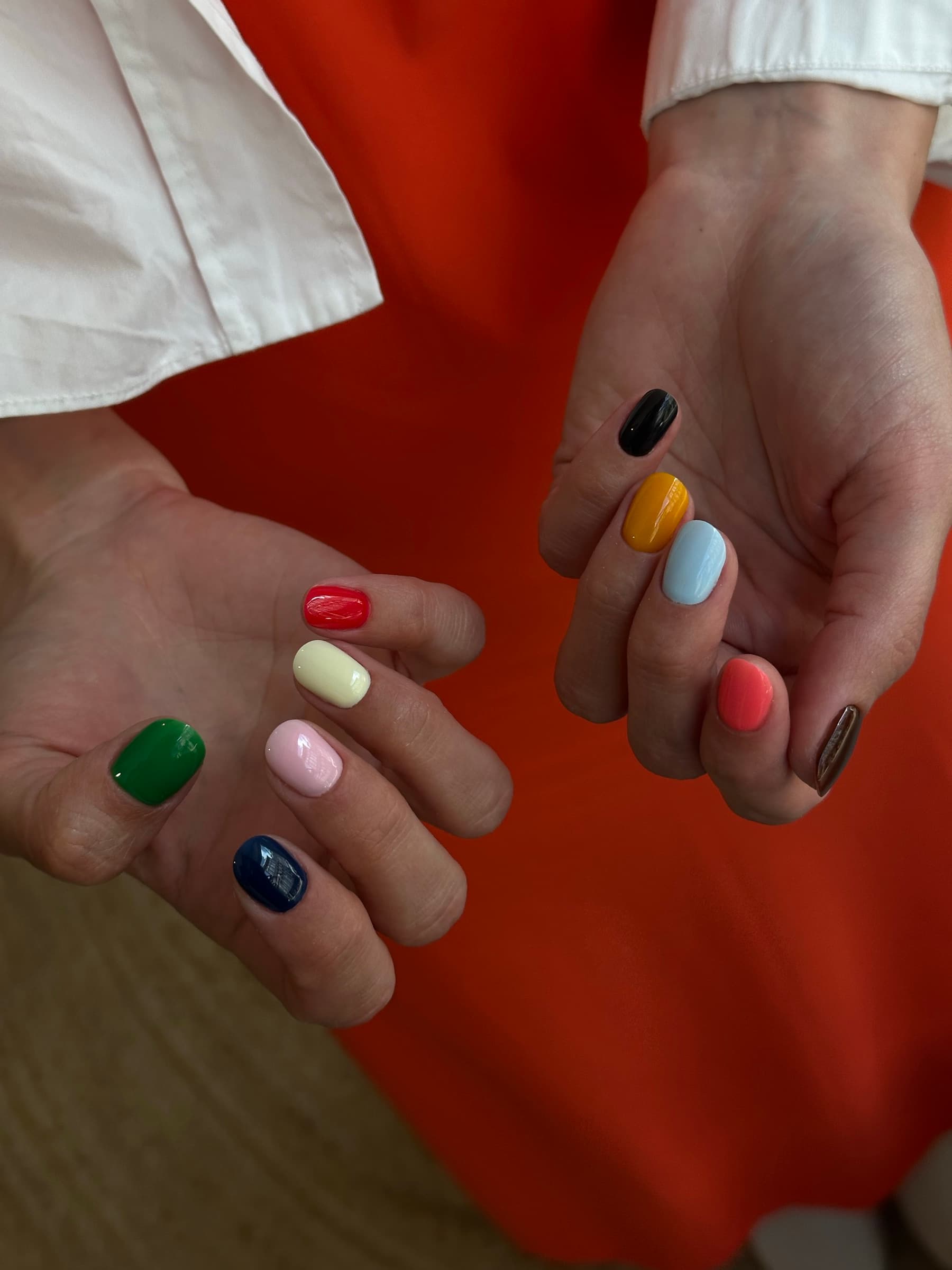 Short square nails in ten different bold block colors, one shade per nail