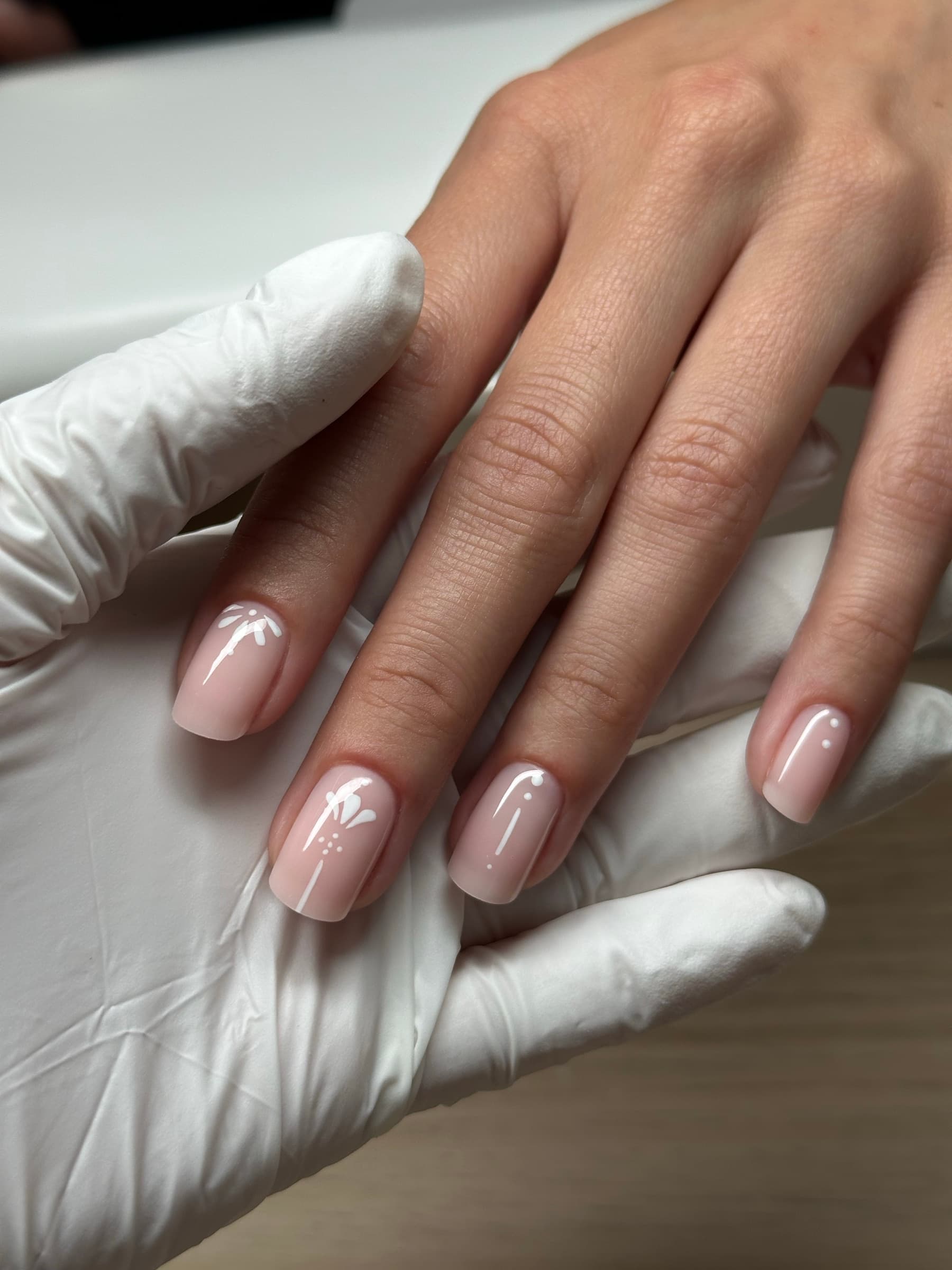 Short square nude nails with minimalist white line and dot accents