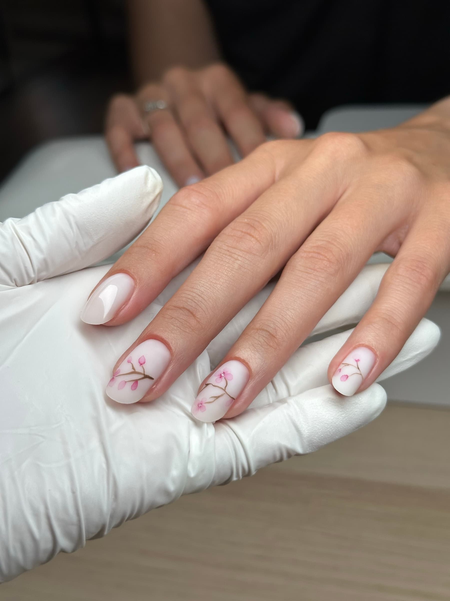 Iridescent chrome nails in a pink, purple, and orange aura finish